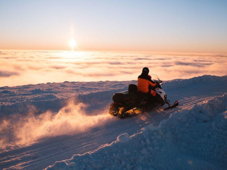 A snowmobile in a beautiful winter scenery in Finnish Lapland